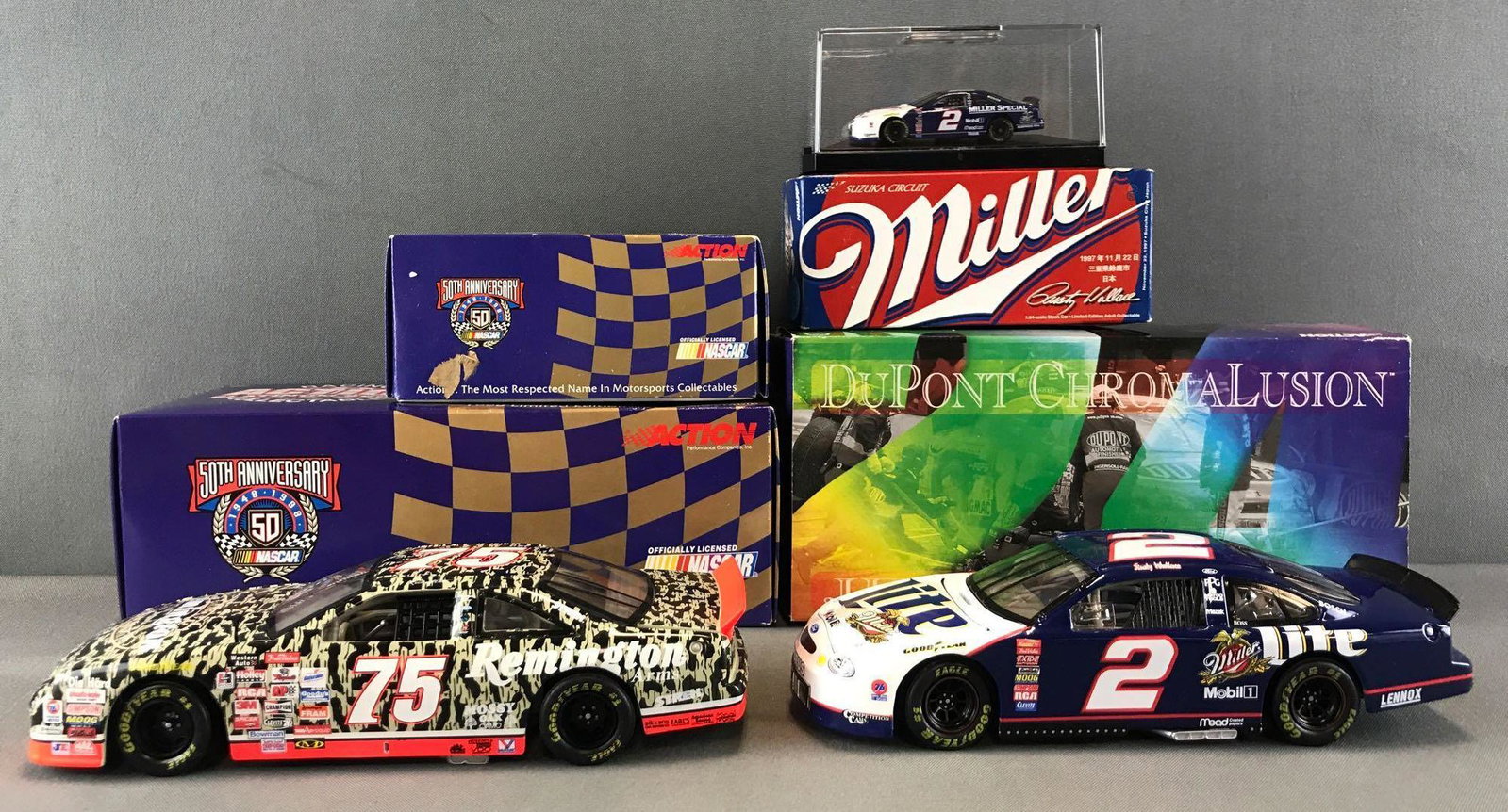 Group of 6 Action NASCAR die-cast vehicles: 4 have original packaging, includes Dale Earnhardt No. 3 Bass Pro Shops 1998 Monte Carlo 1/24 scale, Steve Grissom No. 41 Kodak Monte Carlo 1/64 scale, and more