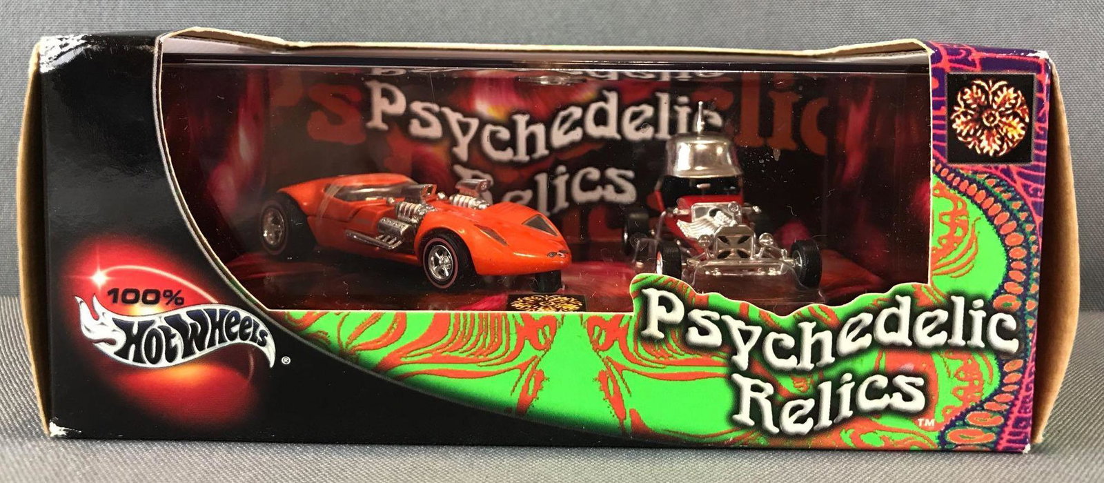 Hot Wheels 100% Psychedelic Relics die-cast vehicle set: Includes Twin Mill and Red Baron. Some damage to box