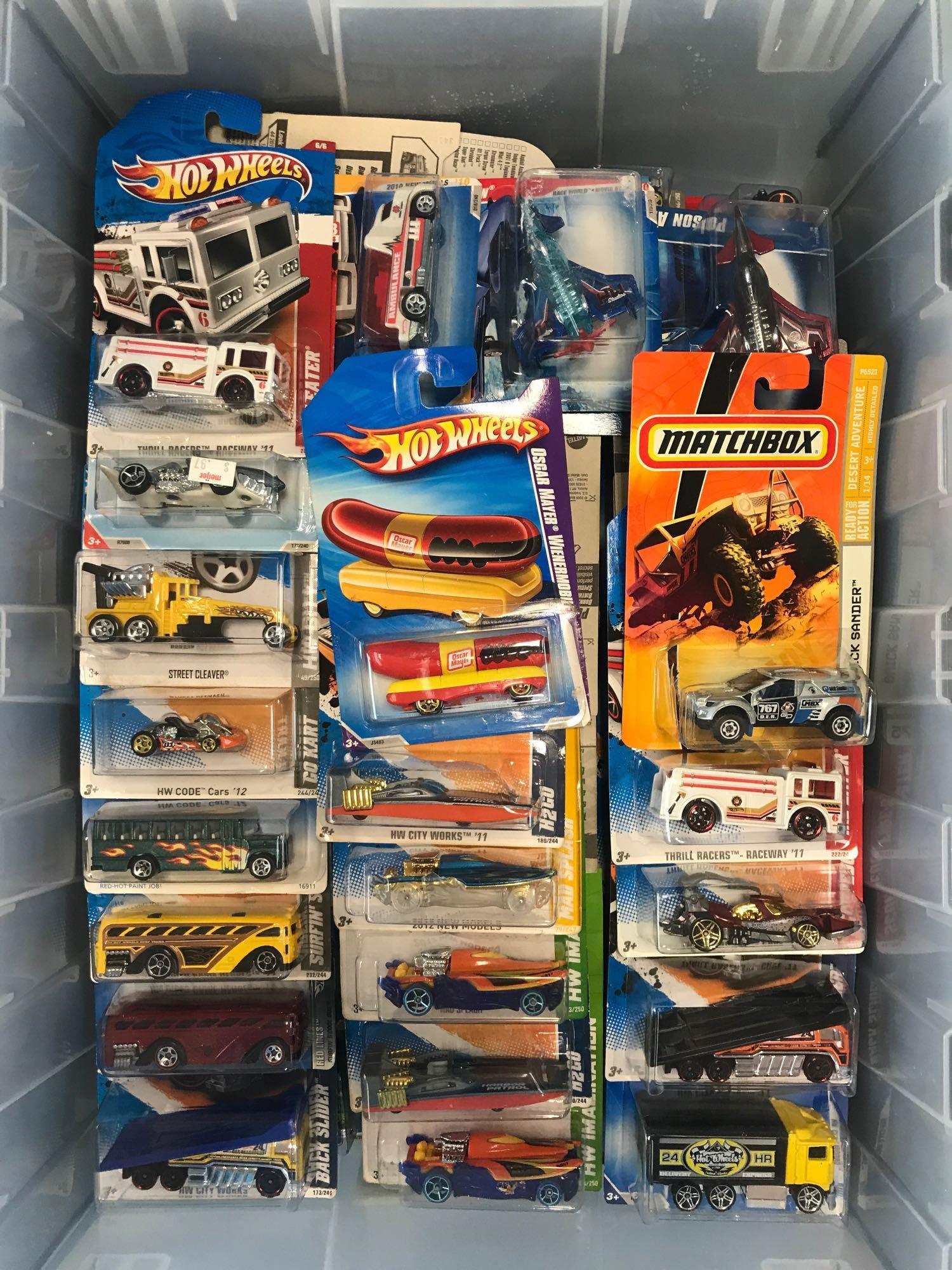 Group of 100+ assorted Hot Wheels die-cast vehicles in (1 of 3)