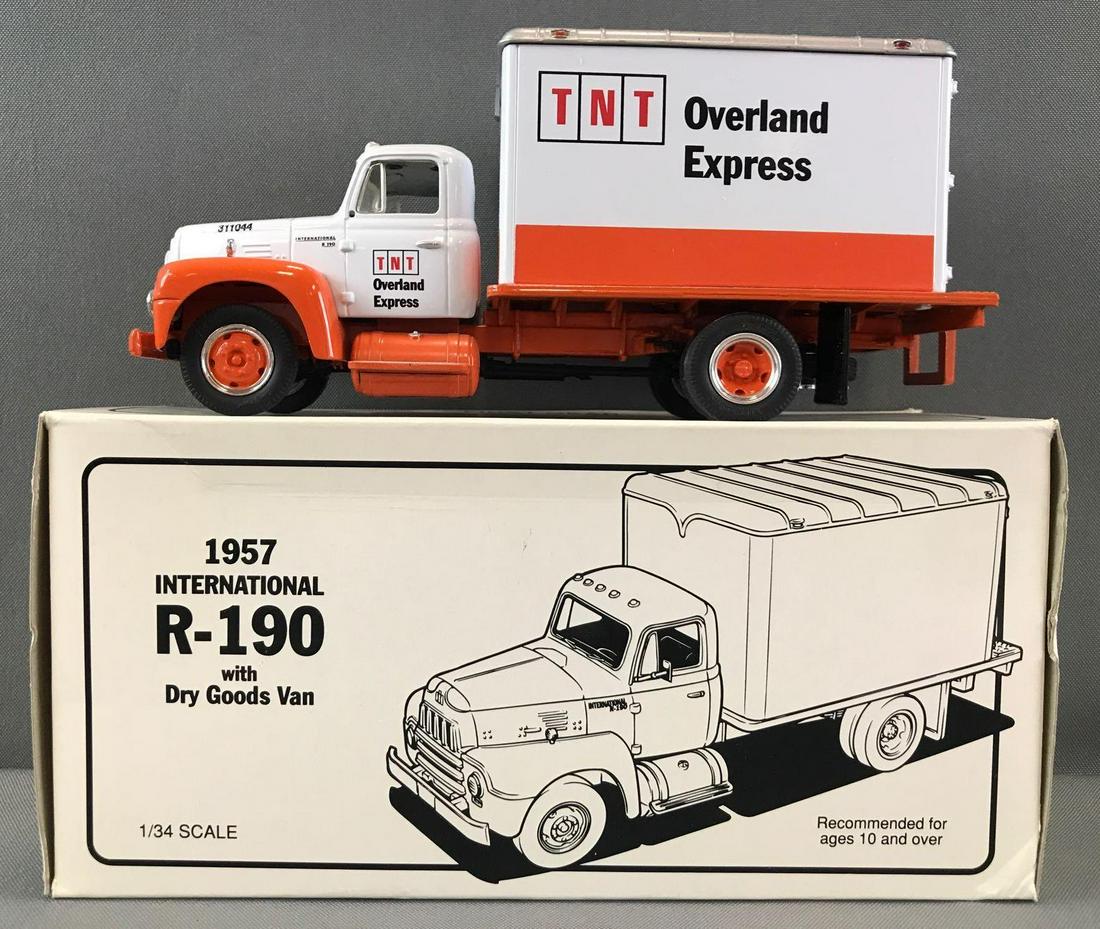 First Gear TNT Overland Express die-cast truck in: 1/34 scale, 1957 International R-190 Dry Goods Van. Some damage to box