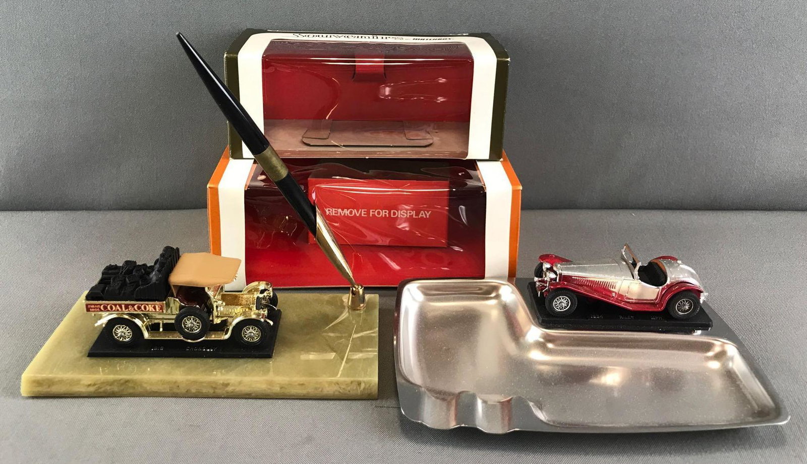 Group of 2 Souvenirs by Matchbox in original packaging: Includes pen holder and ashtray. Ashtray measures 7.5x5.5x1.5 inches