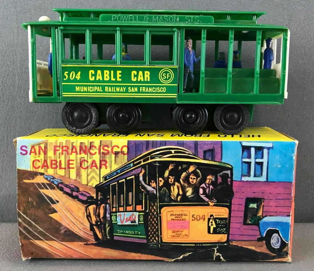 Vintage plastic San Francisco 504 Cable Car toy with: Ringing bell, some damage to packaging, Appx 6.5x3.25 inches