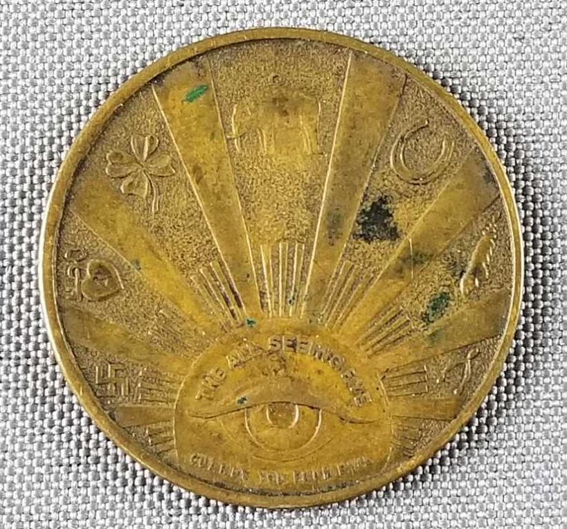 Vintage all seeing eye good luck token: Swami, swastika, horseshoe, clover and other good luck charms pictured on coin. 1.25 diameter