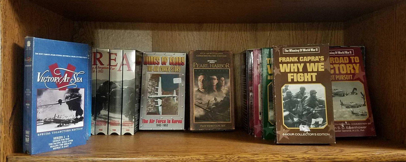 Contents of shelf. VHS TAPES.: Group of War Related VHS Tapes.
