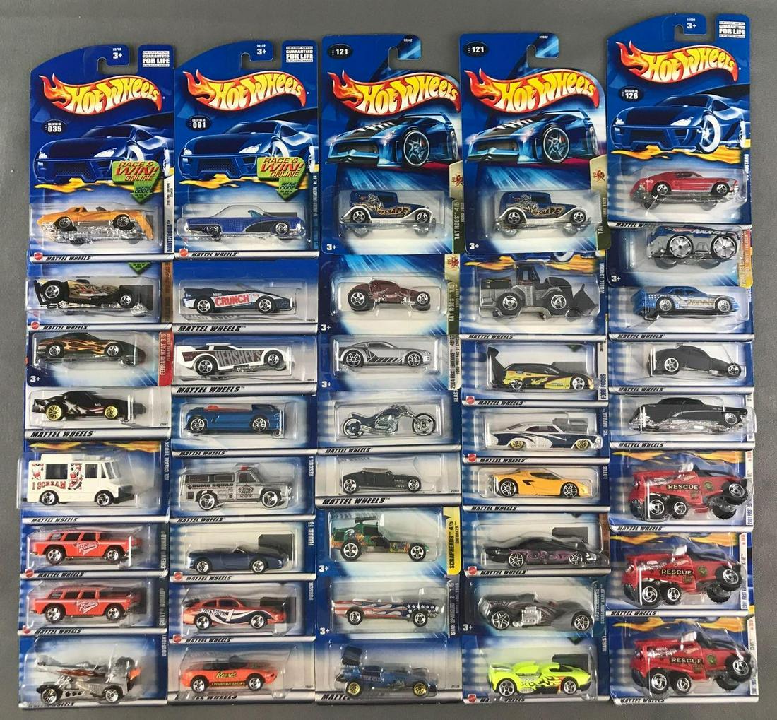 Group of 40 assorted Hot Wheels die-cast vehicles in: Includes Chevy Nomad, Tat Rods So Fast, 65 Impala, and more. Some shelf wear