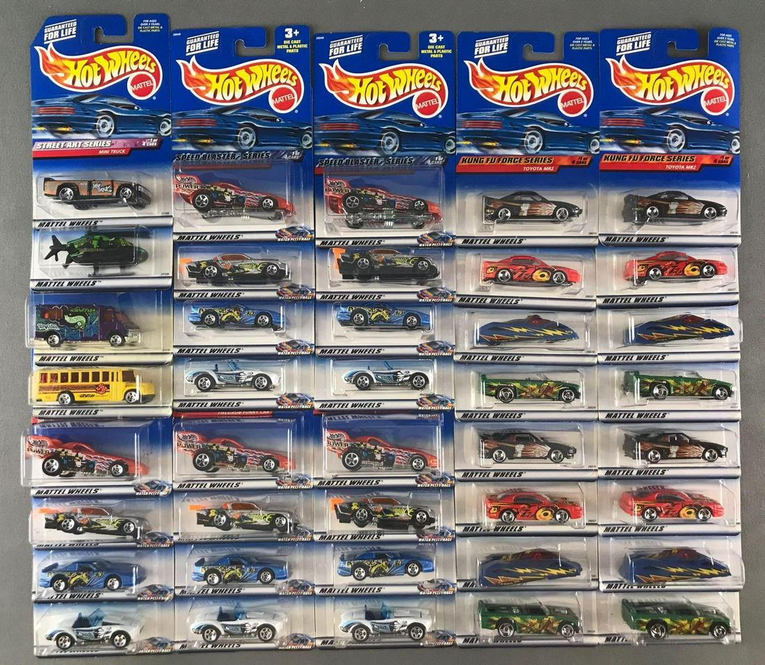 Group of 40 Hot Wheels diecast vehicles in original: (10) 4-vehicle series including Kung Fu Force, Speed Blaster, and Street Art. Some minor damage to packaging and shelf wear