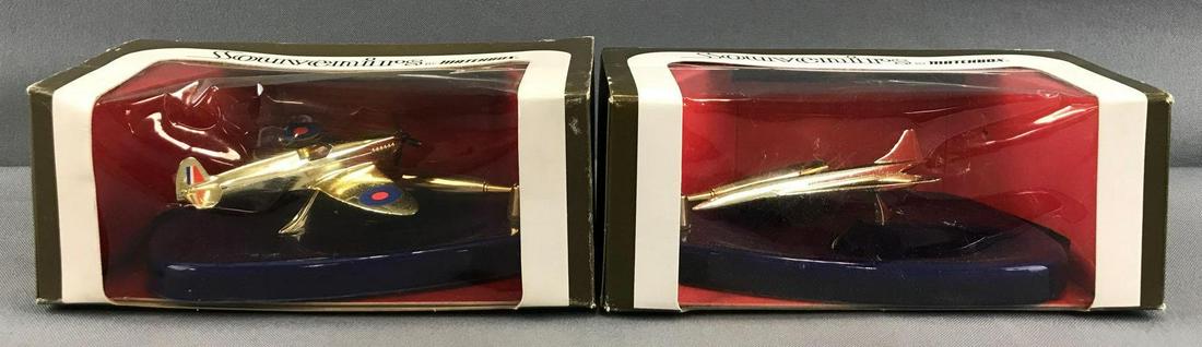 Group of 2 Souvenirs by Matchbox pen stands in original: Damage to both packages, 7x3.5x3 inches. Blue oval pen stands