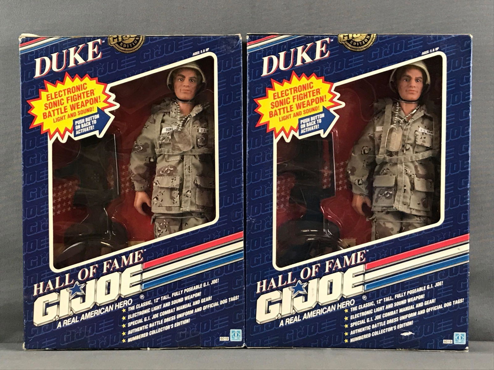 Group of 2 Hasbro GI Joe Hall of Fame Duke Action: New in original packaging, 12 inch action figures in 9x2x12.75 inch packaging. Some shelf wear, minor damage to packaging