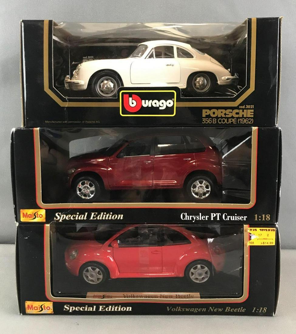 Group of 3 1:18 scale die-cast vehicles in original: Includes Burago No. 3021 1962 Porsche 356B Coupe, Maisto Special Edition Chrysler PT Cruiser, and Volkswagen New Beetle. Some package damage and shelf wear
