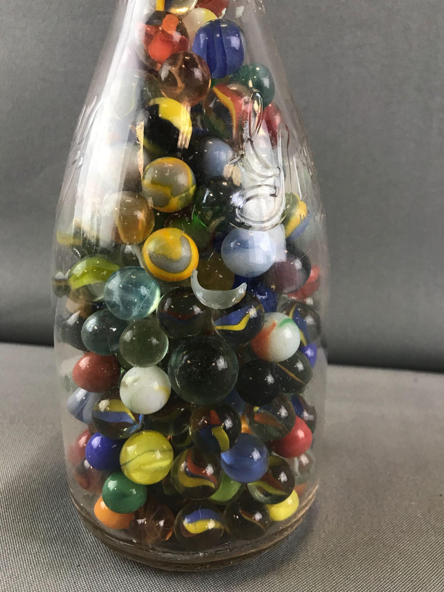 Marbles-Quart size Gridley Dairy Products glass milk: Bottle is 4x8.5 inches. Assorted colors, sizes, and types.