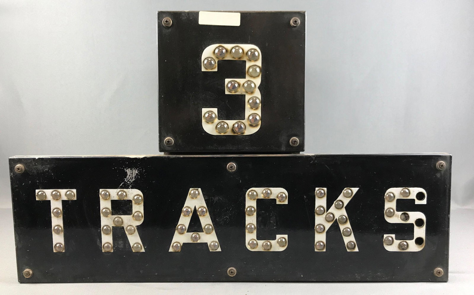 Vintage "3 Tracks" Reflective Railroad Crossing Sign: 27 1/2 x 17 x 15 1/2 inches;heavy sign with glass reflectors. Due to the size and weight of this lot, in-house shipping is not available. Third party shipping or pick up at our Gallery in Ottawa is re