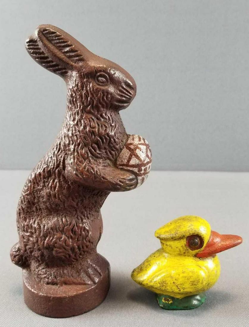 Set of 2 : Solid Cast Iron Animals: Lot contains a 7 inch tall Easter bunny doorstop and a small yellow duck. Both painted