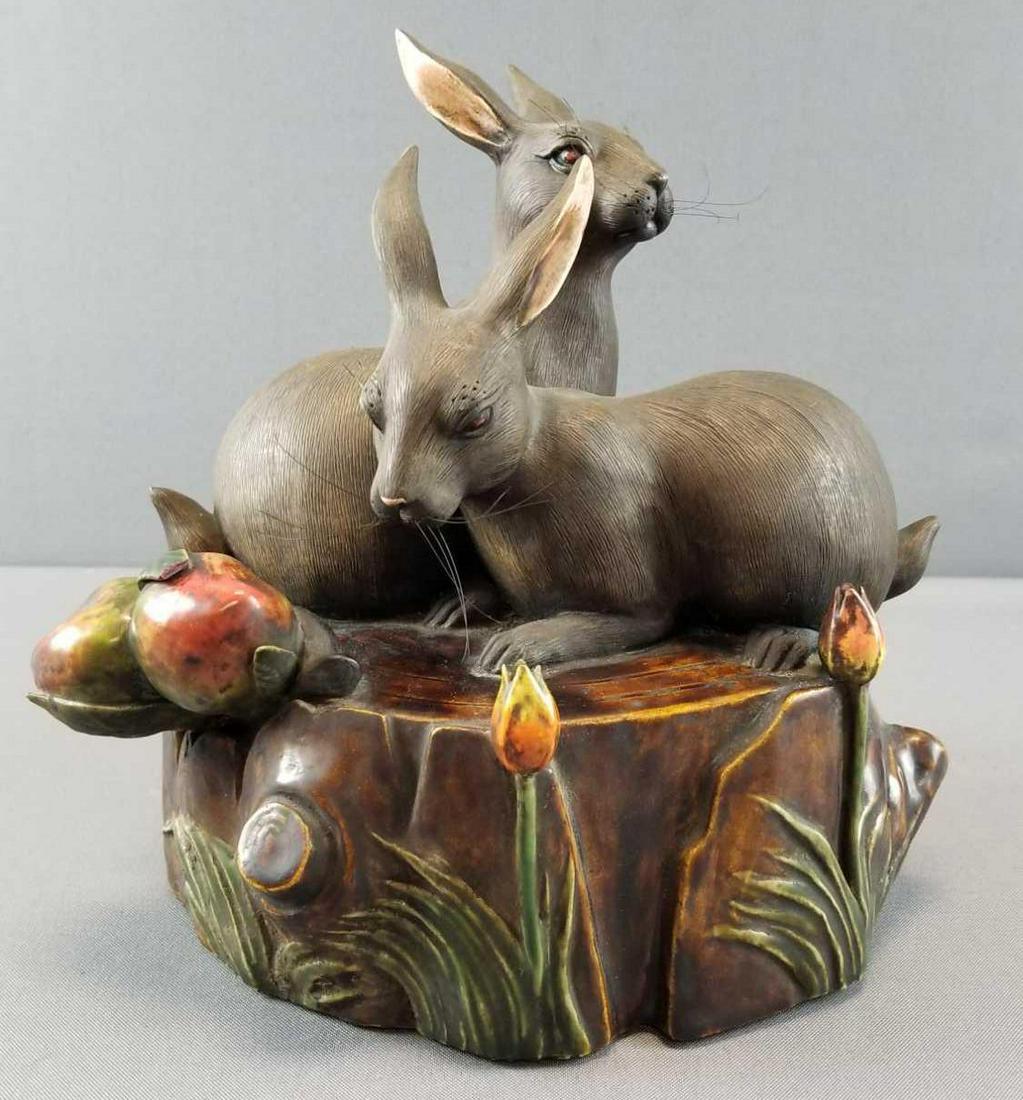Vintage Asian Rabbit Pottery Figurine: 9 x 10 inches. Signed inside. Features 2 rabbits/hares on tree trunk, flowers. Some chips on flowers