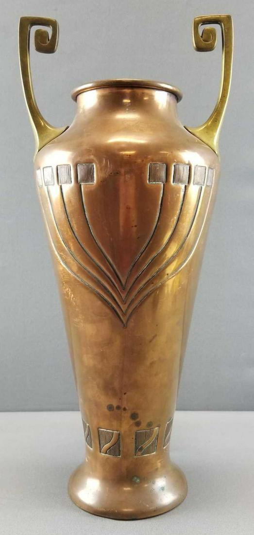 Art Nouveau Copper and Brass Amphora Vase by WMF: This large 20 inch tall copper and brass amphora vase by German metal work company WMF exhibits an exceptionally stylish art nouveau presentation and only the slightest wear consistent with age