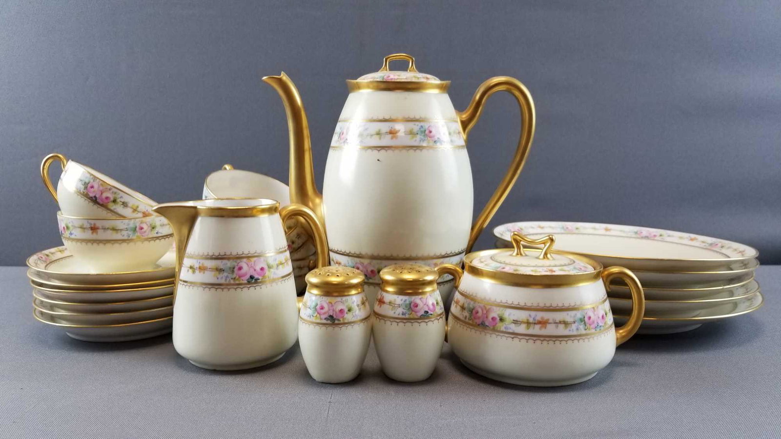 Lot of 24 Pieces : Bavaria China Dinnerware: Teapot is 9 inches tall. Large plates have a 8 1/2 inch diameter