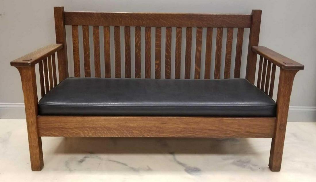 Vintage Craftsman Mission Style Bench: Some minor wear and finish issues consistent with age. 64 x 36 x 26 1/2 inches. In-house shipping is not available for this lot; arrange third party shipping or pick up at our Gallery in Ottawa