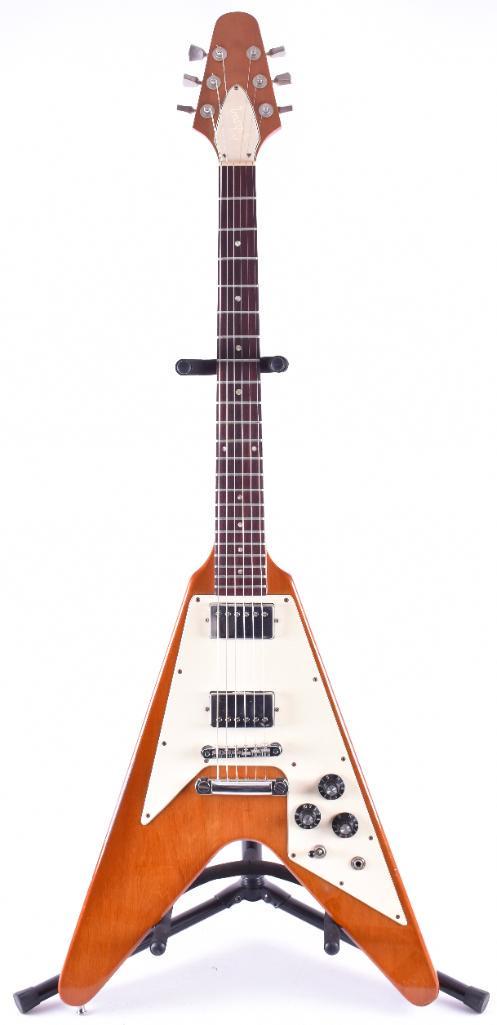 1981 Gibson Flying V Electric Guitar with Case: Serial Number 80081017, Made in the USA, All original, Tim Shaw Humbucker pickups, Super Good Action and Neck is Solid, A+ Condition, Barely any buckle worming, Some stand wear. Professionally cleaned