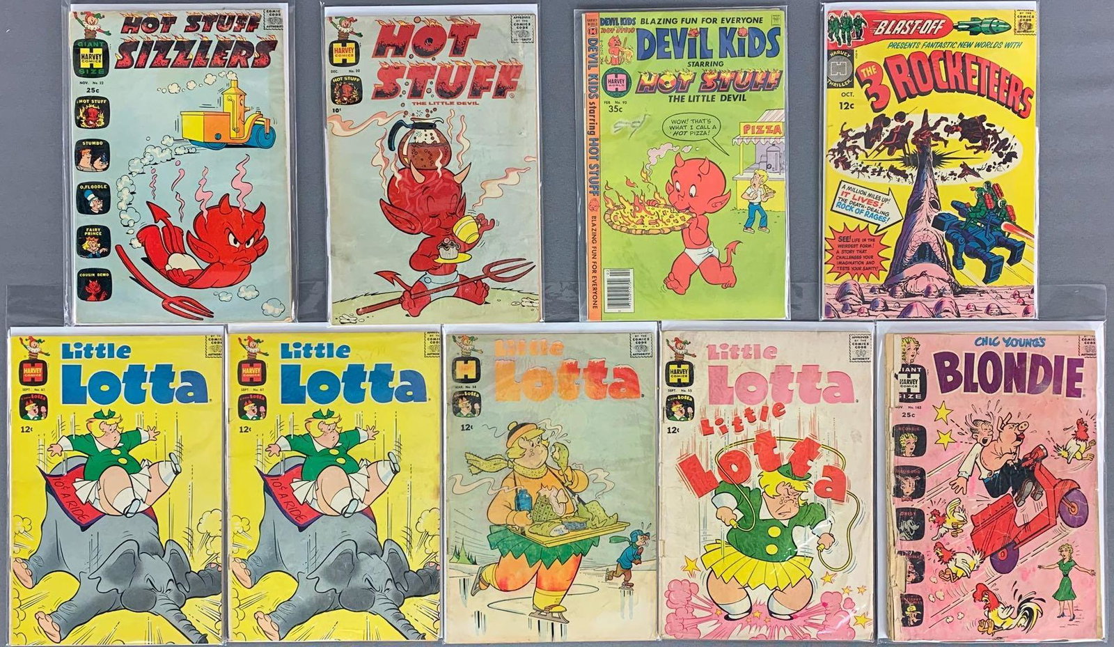 Group of 9 Harvey Comics Assorted Comic Books: Includes Hot Stuff Sizzler, Devil Kids, The 3 Rocketeers, Little Lotta & Blondie. Some bagged and boarded, includes duplicates.