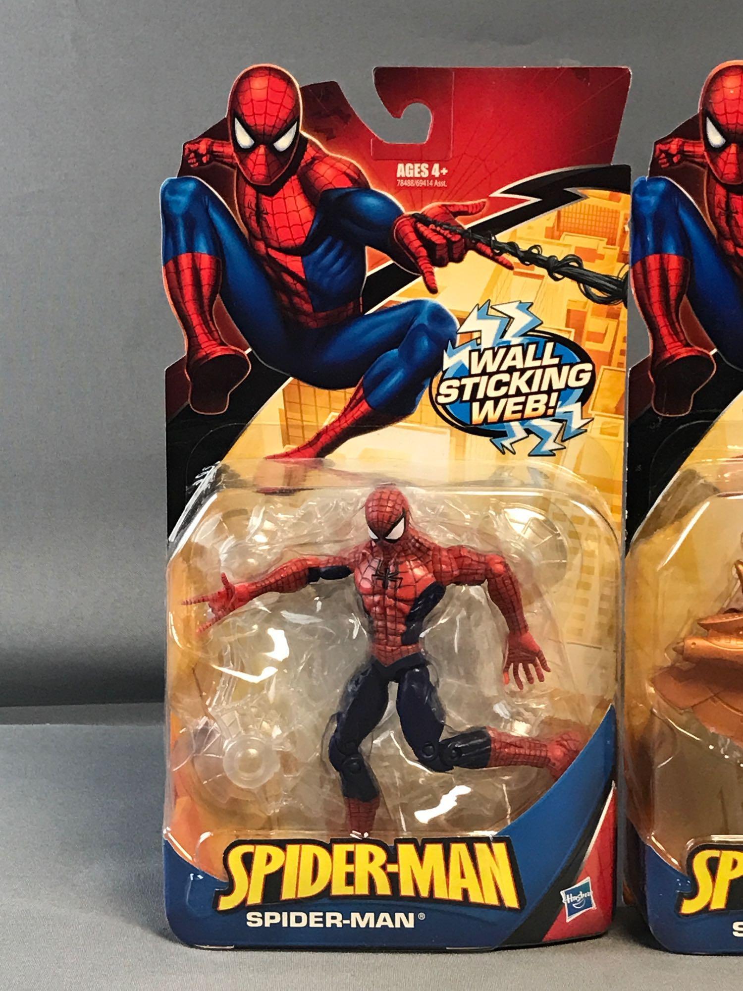 Group of 4 Hasbro Marvel Spider-Man Action Figures: Measures 12.5x6x2 inches in original packaging. Includes two Wall Sticking Web, Snap-On Rocket Armor, Snap-On Scuba Gear.
