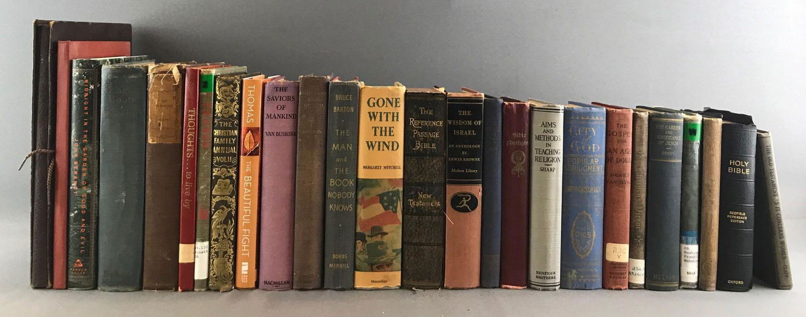 Group of 26 assorted religious books: Mostly religious books, some fiction and more. Includes Bibles, Hymn books, Prayer books, The Gospel for an Age of Doubt, The Old Testament as it Concerns Women, The Federalist, Gone With The Wind, an