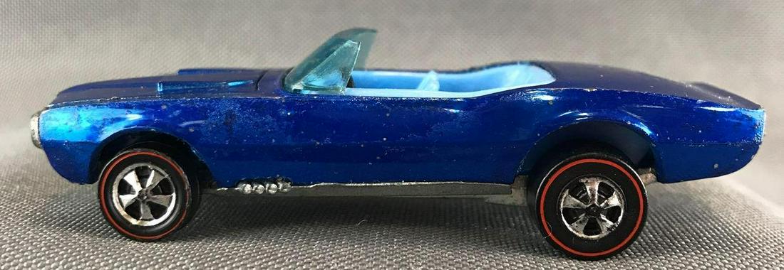 Hot Wheels Redline Custom Firebird die-cast vehicle: Hong Kong, 1967 Mattel, Inc. Blue Body Color. Near Mint to Excellent Condition with noticeable scuffs and toning throughout. Light blue interior.