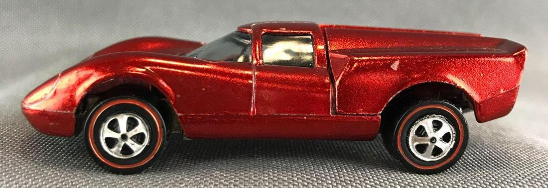 Hot Wheels Redline Lola GT 70 die-cast vehicle: 1968 Mattel, Inc. Red Body Color. Mint Condition, The car appears mint at first glance. Upon close inspection shows slight imperfections, very minor limited chips. Black interior