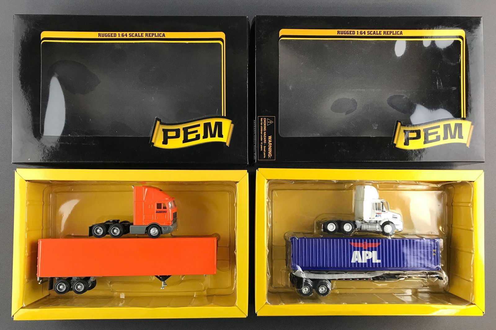 Group of 2 PEM/Tonkin Replicas Die-Cast Tractor Trailer: 1:64 scale. Includes Schneider National in APL box and missing top plastic insert and APL in like new condition.