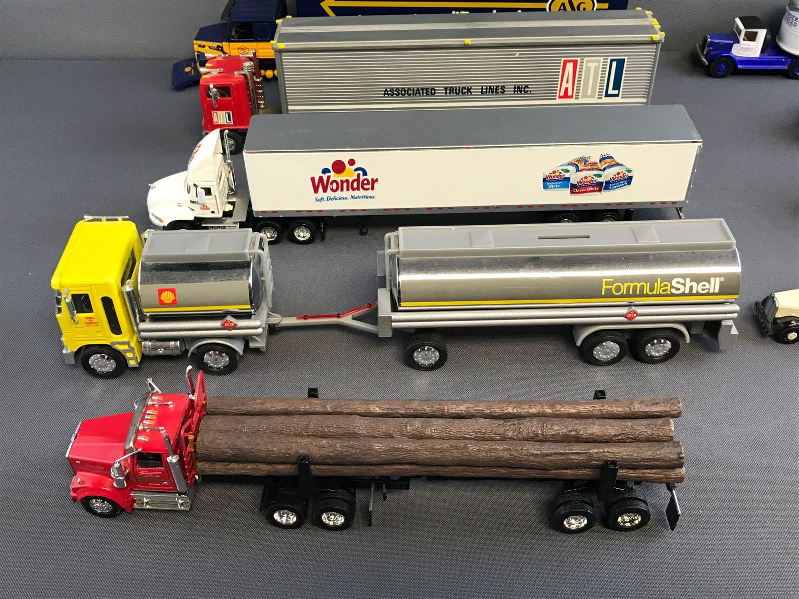 Group of 12 assorted die-cast tractor trailers and more (1 of 4)