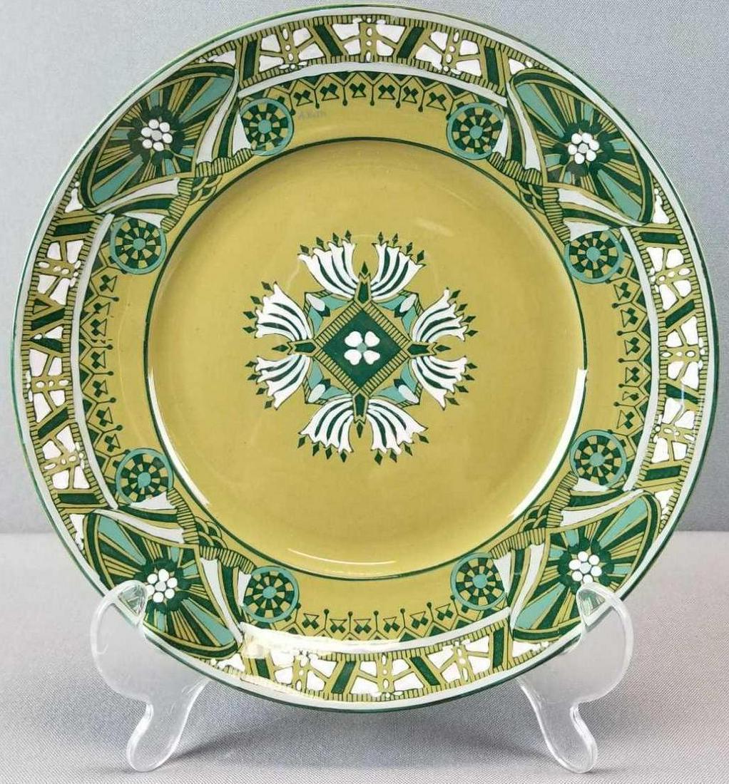 Antique Buffalo Pottery Emerald deldare ware plate: Signed, 1911. 8.25 inch diameter. No chips or cracks. Some small surface scratches.