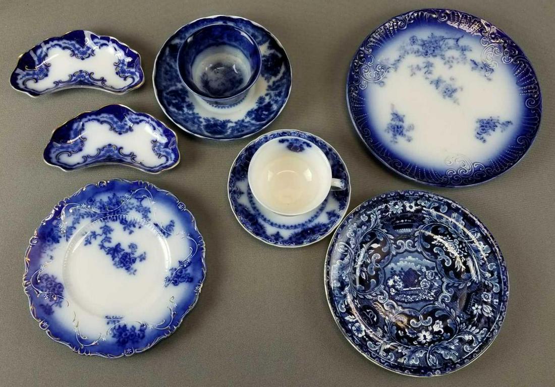 Group of vintage flow blue china dishes: Teacups and saucers, sauce dish, plates. La Belle china, Albany royal China. Some hand decorated with gold. Largest plate is 9.75 inch diameter