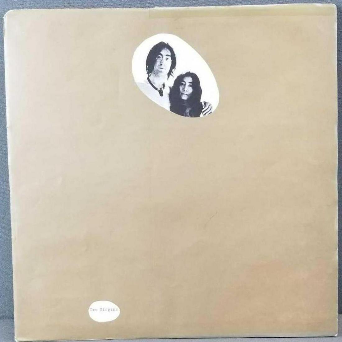 Two Virgins album John Lennon and Yoko Ono: Outer paper sleeve is torn and taped.