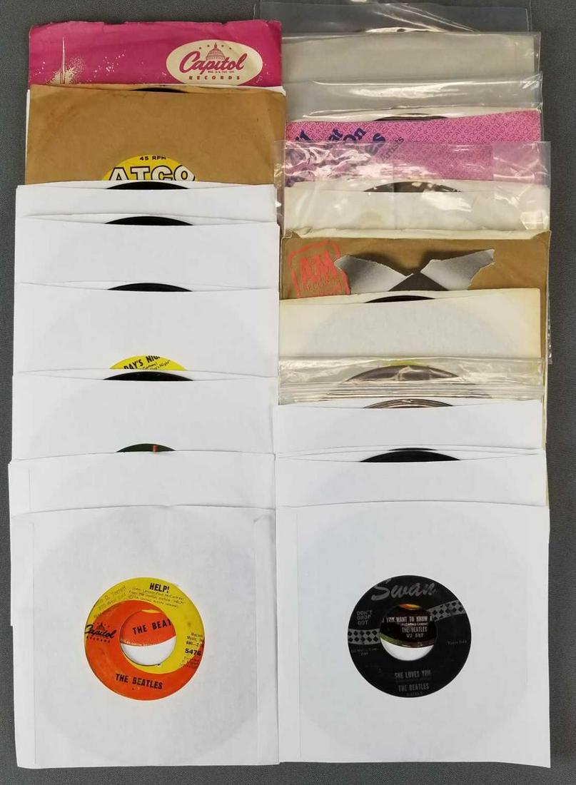 Group of 23 Beatles 45s: Most record albums in replacement sleeves.