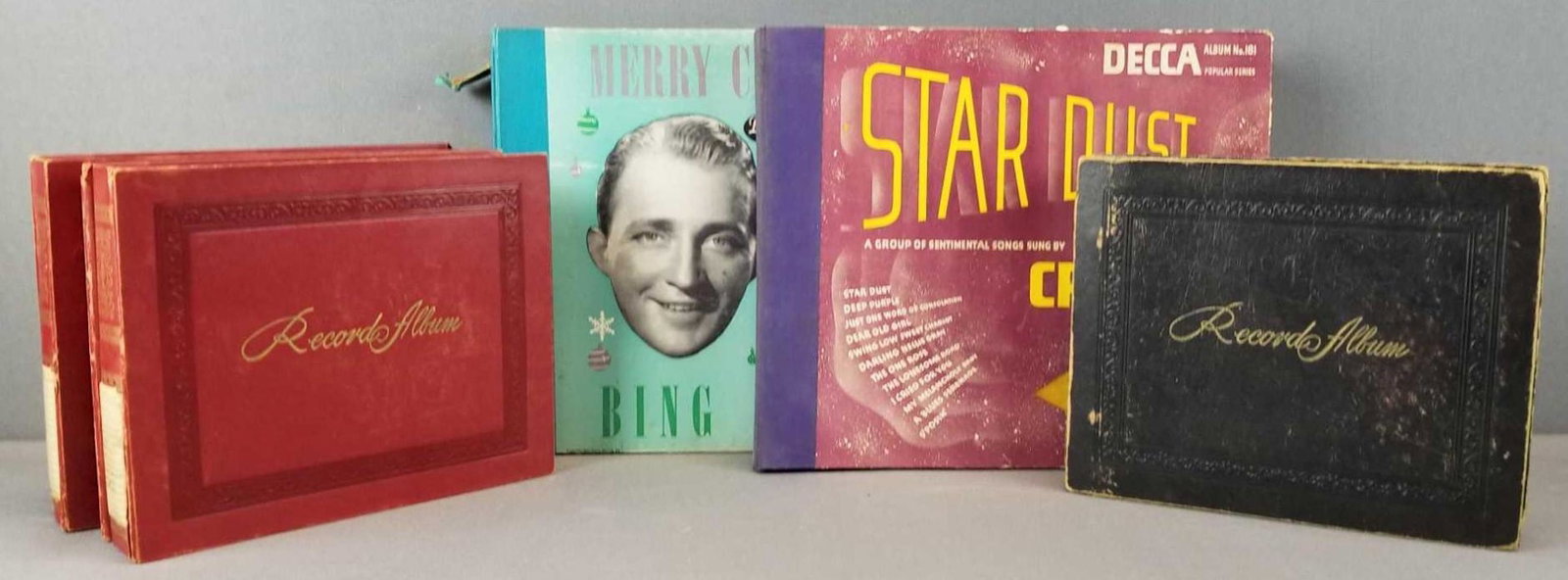 Group of vintage record albums: Bing Crosby LPs, various artist 45 rpms. One album is broken