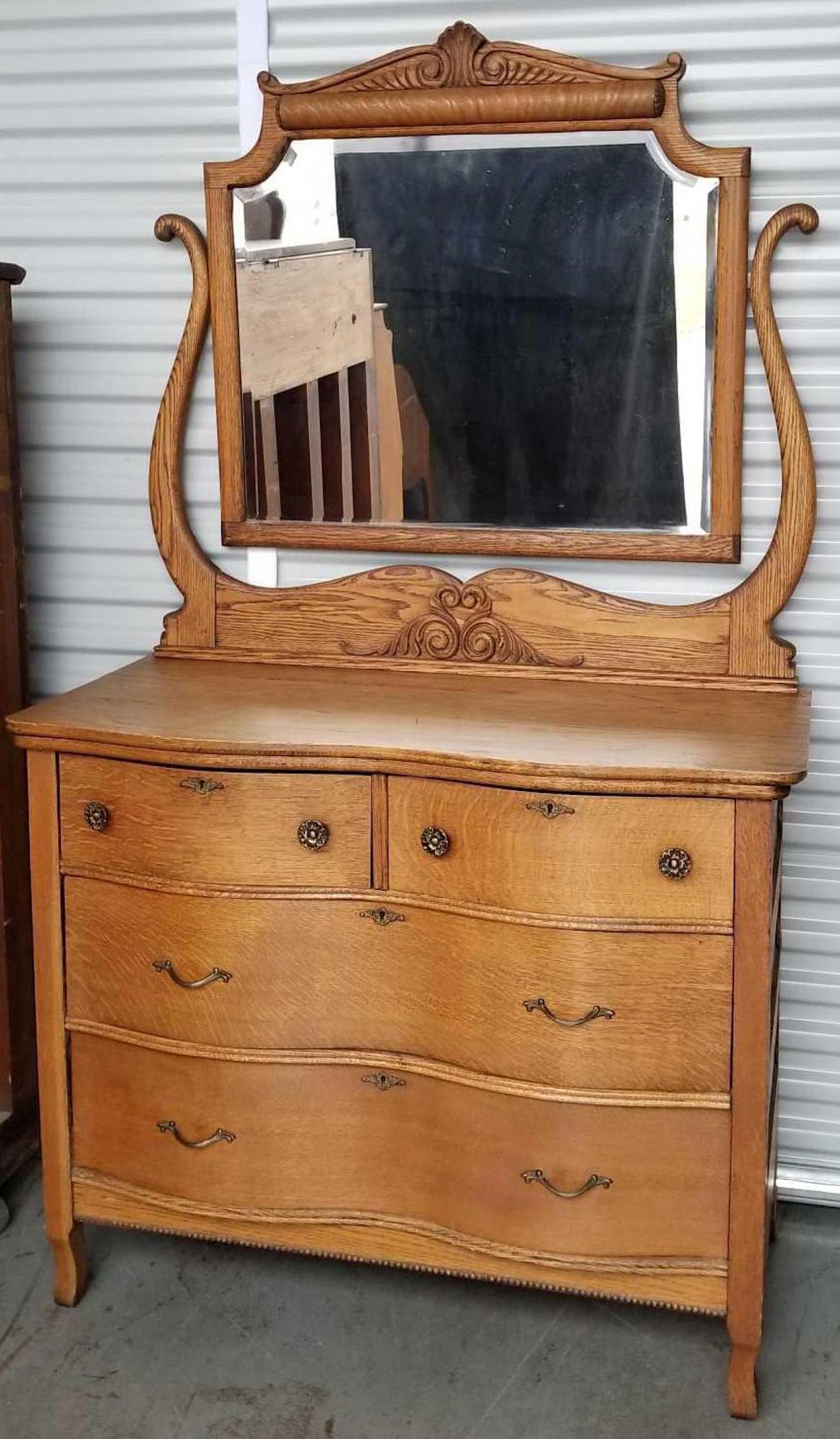 Antique oak dresser with mirror: 41.5 x 71 x 20 inches. No shipping available.