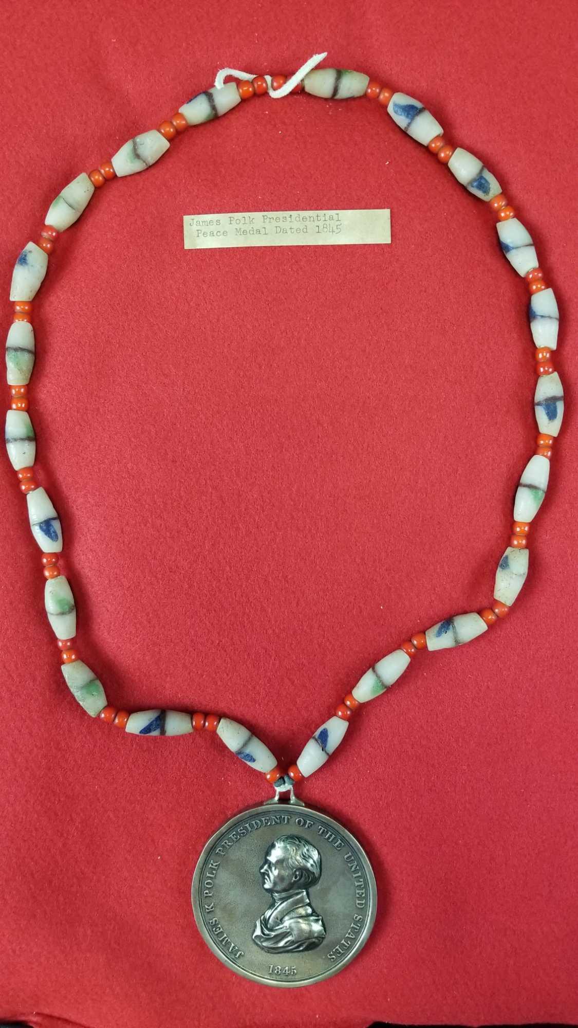 James Polk peace and friendship medal: Reproduction. On beaded necklace, coin dated 1845, James K Polk, President of the United States. Coin measures 2.75 inch diameter