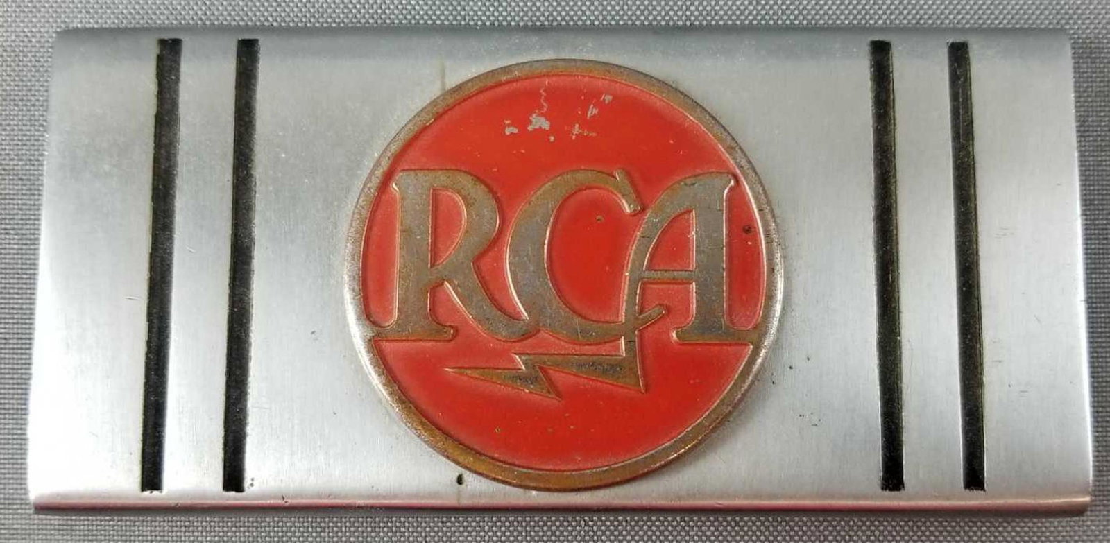 Vintage RCA metal nameplate/emblem: 4.75 x 2.25 inches. Minor wear and scratches consistent with age.