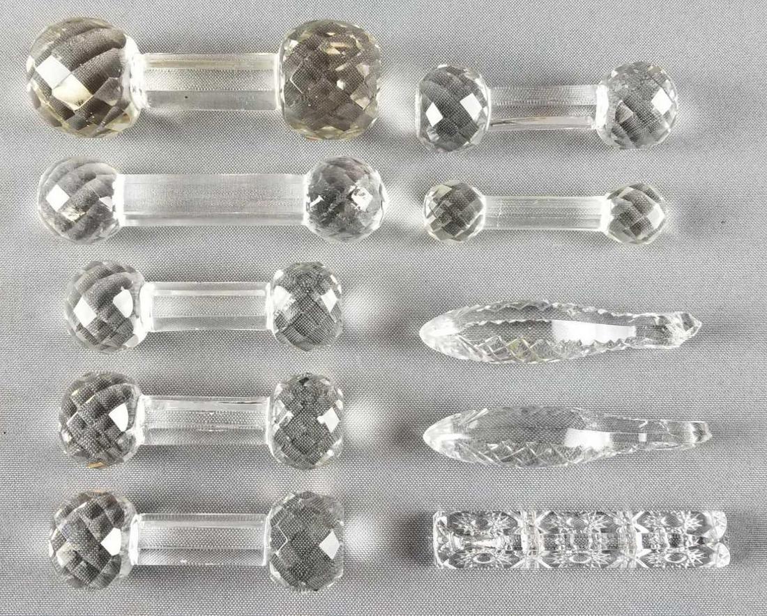 Group of 10 vintage crystal knife rests: 2 fish shaped. Largest is 4.5 inches wide. Some scratches and chips consistent with age