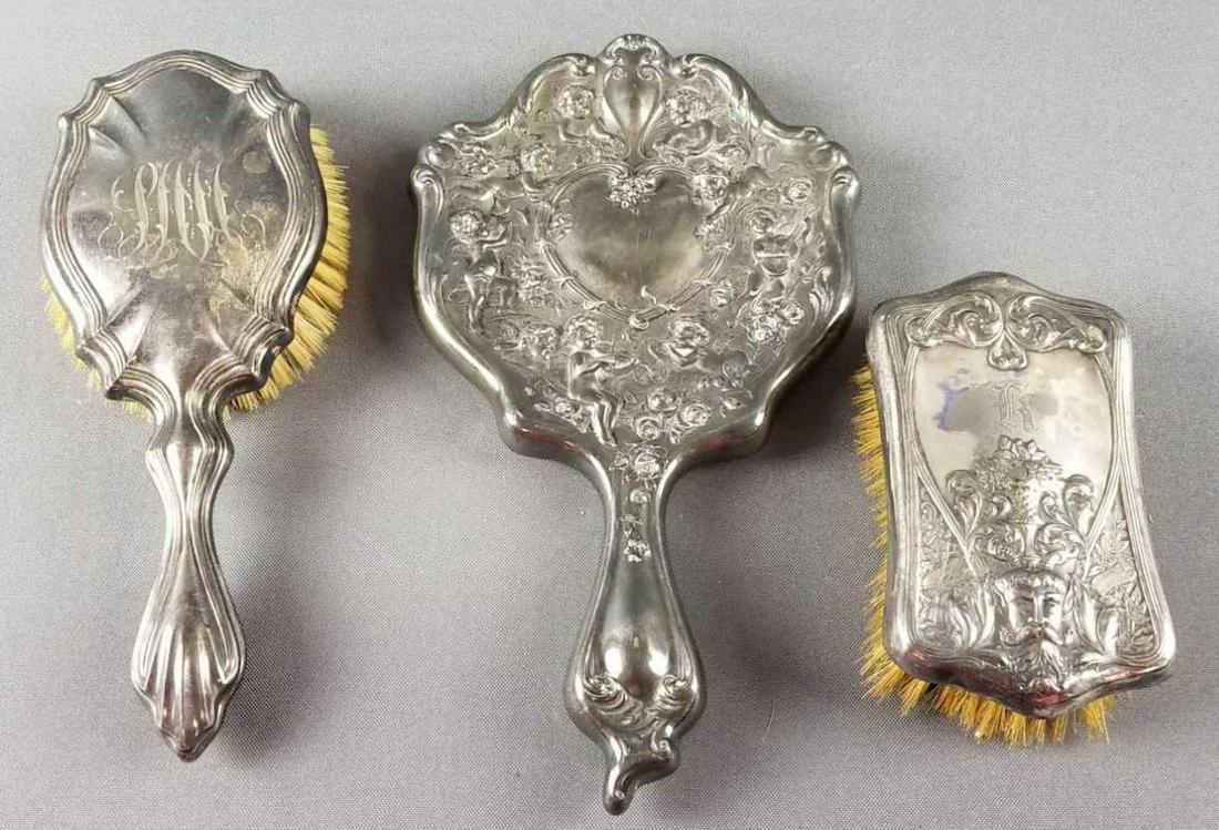 Group of 3 vintage silver plate hairbrushes and hand: Mirror measures 6 x 10 inches