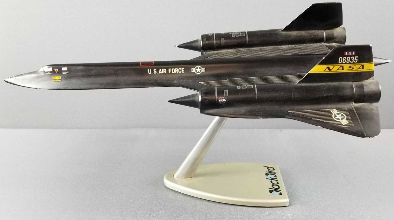 US Air Force die cast model Blackbird: Attached to base, aircraft measures 17.5 inches long, 9 inches wide. Some wear, scratches.