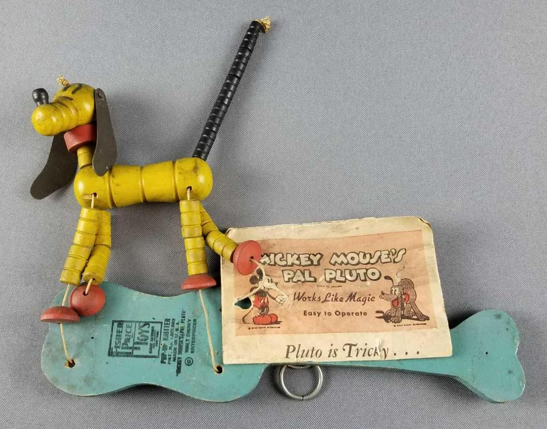 Vintage Pluto pop up kritter: Fisher price, Mickey Mouses pal Pluto, Walt Disney enterprises. Handle is 9.5 inches long. Working condition, dirty.