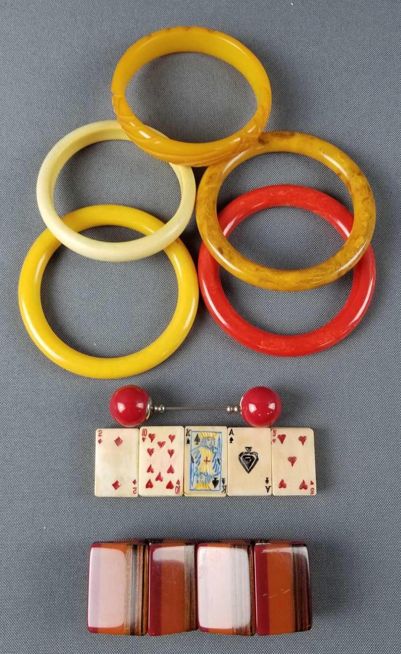 Group of 9 vintage bakelite bracelets and more: 5 bangles, 2 stretch bracelets, pins.