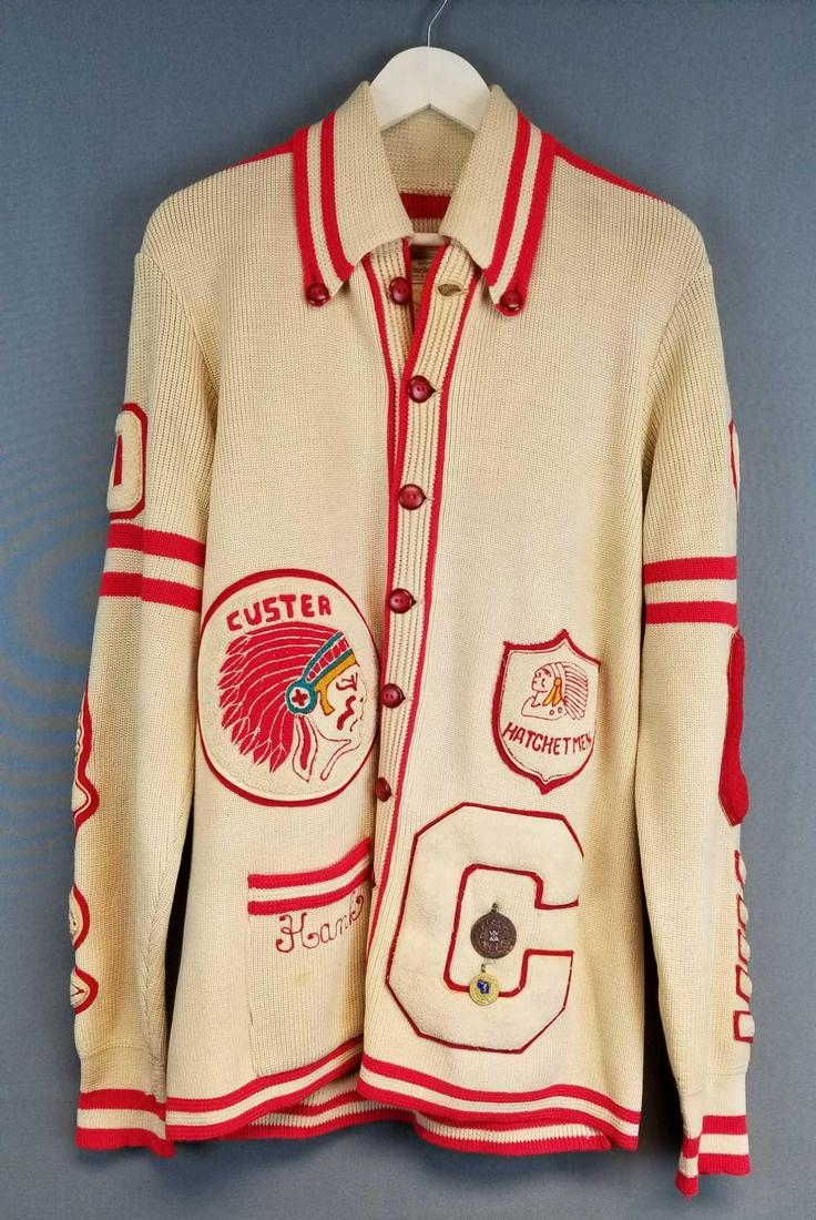 Vintage Letterman sweater: Custer, Hatchetmen patches, plus multiple sports patches. Award pins dated 1969.