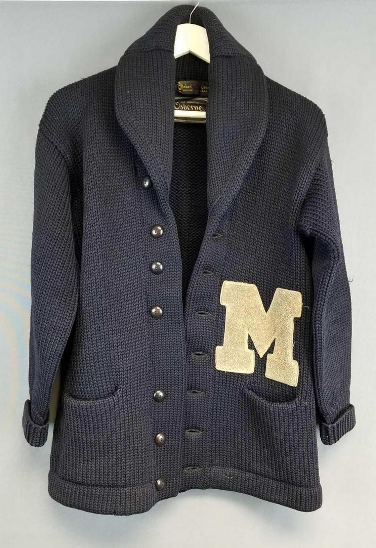 Vintage university sweater: Navy blue with M. Collared button down sweater, missing one button. A few snags, bottom hem is slightly frayed in spots. Made by Oakes bros, Boston Massachusetts