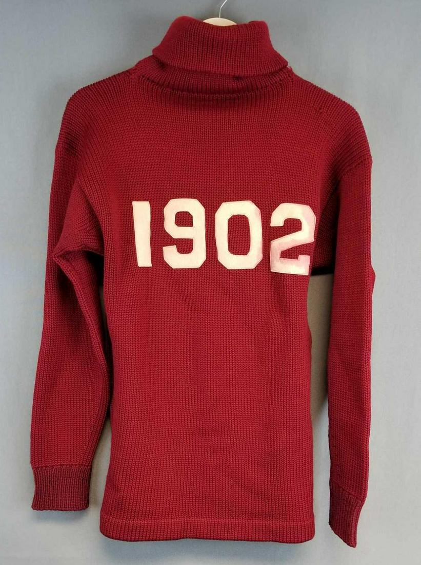Vintage 1902 varsity turtleneck sweater: Maroon, white numbers. Some staining on numbers. Minimal wear, some small holes.