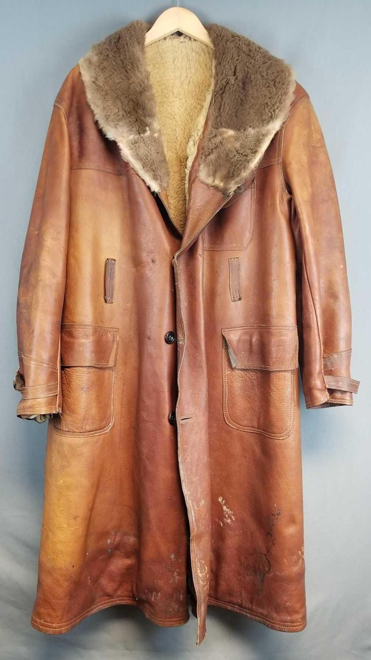 Vintage lined leather mountain coat: Well worn. Leather is stiff. Very heavy