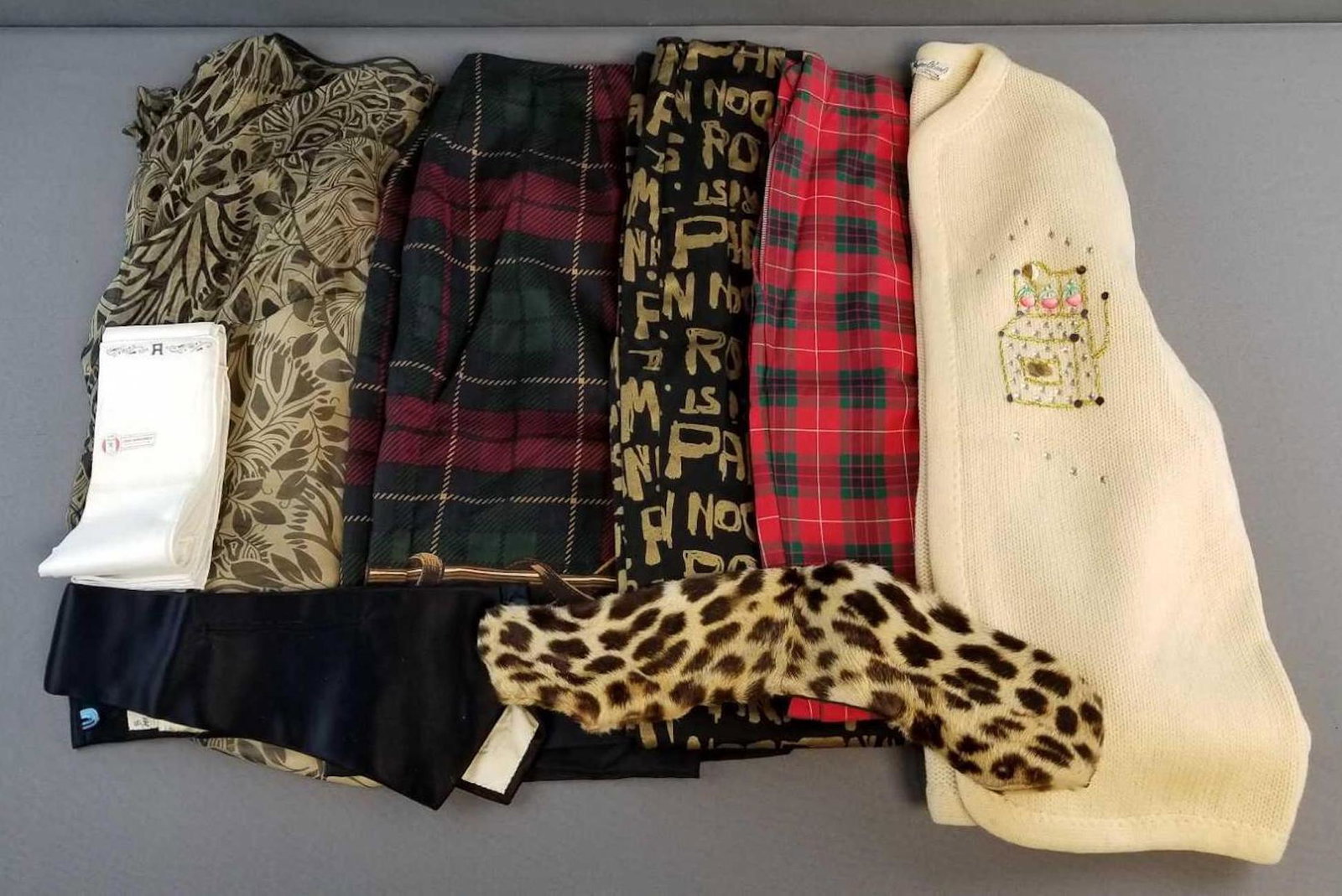 Group of vintage clothing and accessories: Skirt by Brooks brothers, pants, sweater, handkerchiefs, cummerbund and more
