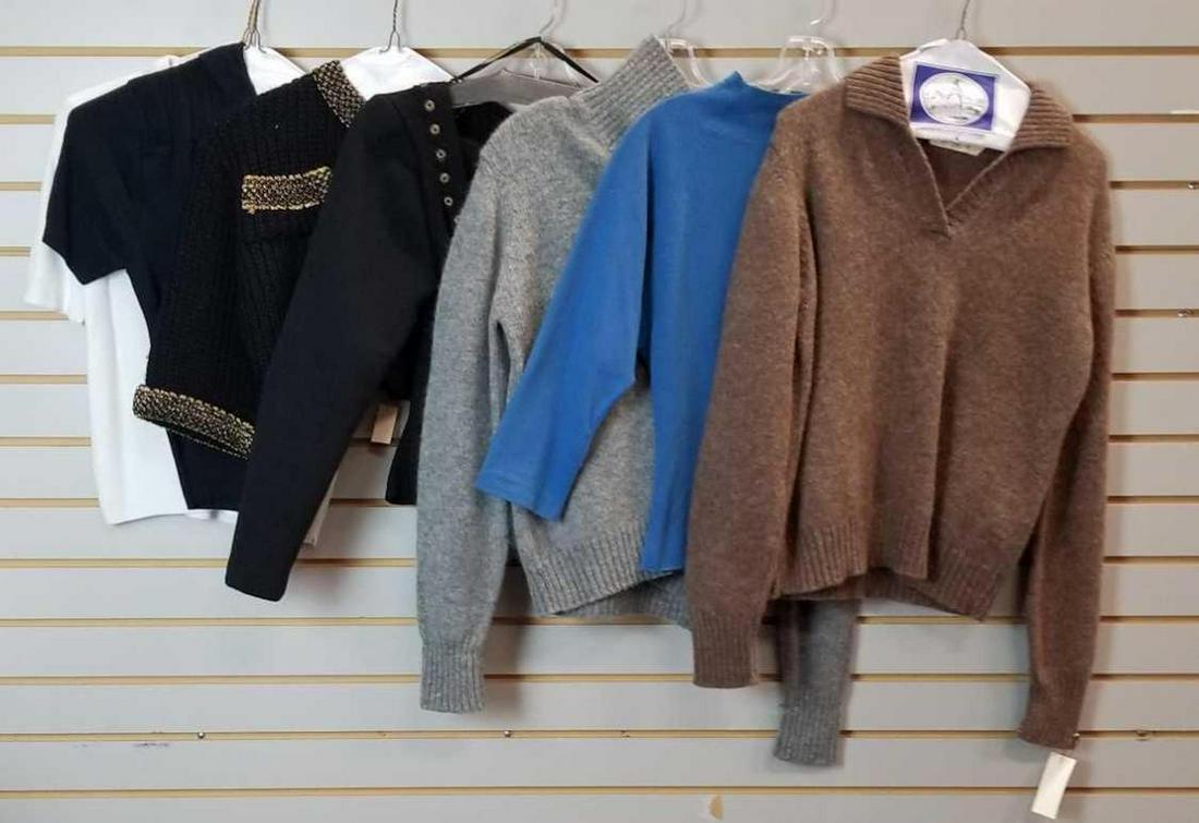 Group of vintage ladies clothing: Most are vintage. These items came from a film set and are possibly tailored or modified. Shirts, sweaters, blouses, skirts