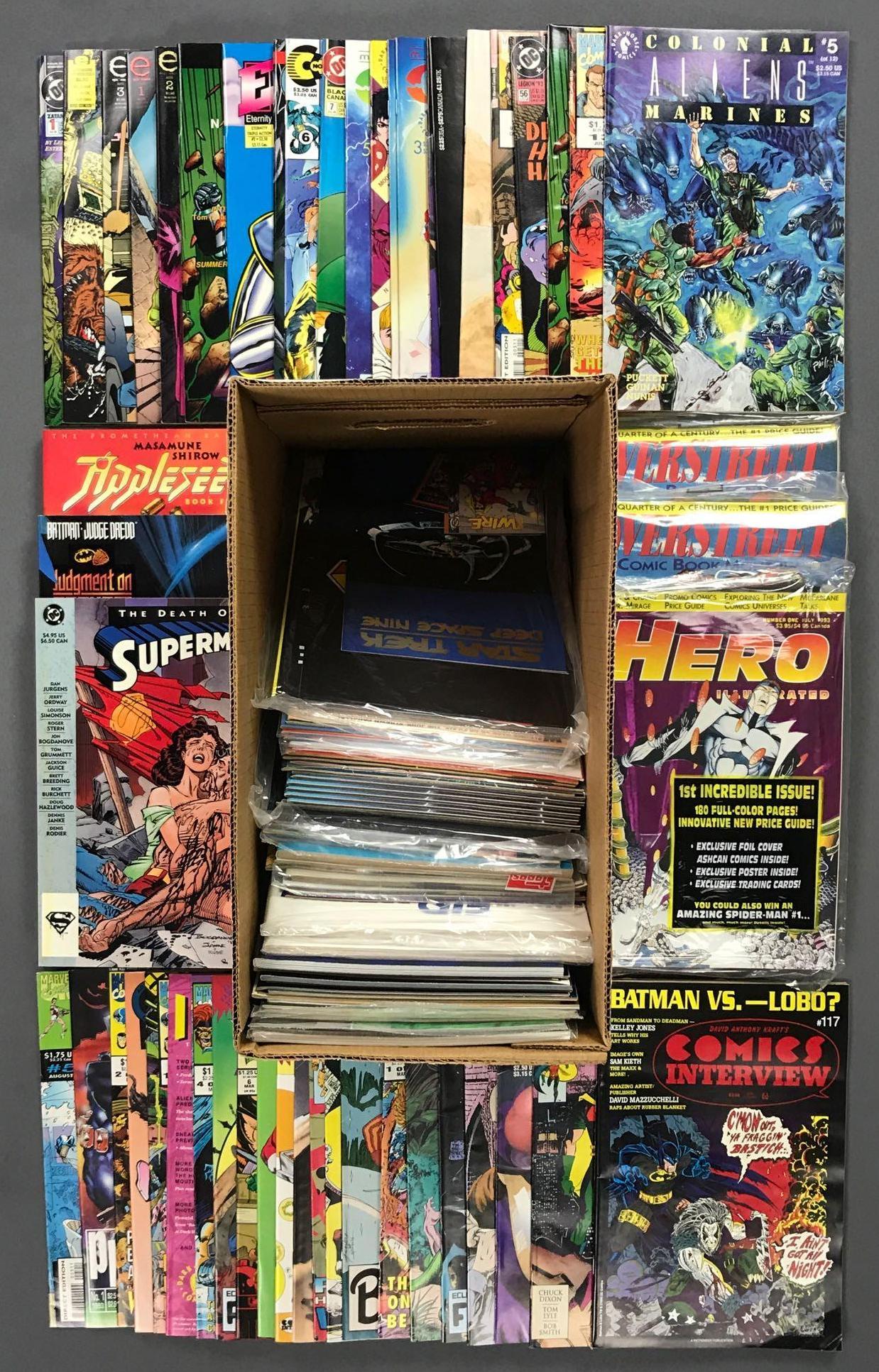 Short Box approximately 100 assorted comic books and: Includes DC, Marvel, Dark Horse and more featuring Batman, Aliens, Superman and more. Includes trade comics, magazines, comic books and more and includes duplicates.