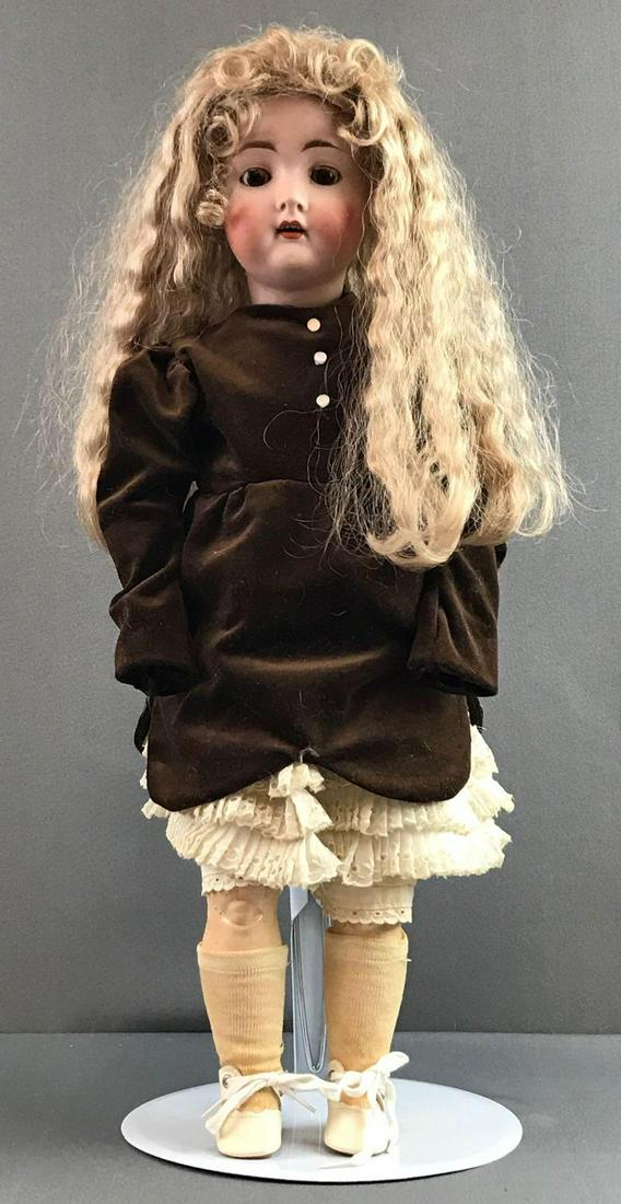 Antique 20 inch German bisque doll Hertel Schwab: 136/8. Brown sleep eyes with painted and applied lashes, socket head, open mouth with teeth, composition and wood jointed body. Some cracking, paint loss to body. Brown velvet dress, under garments, s