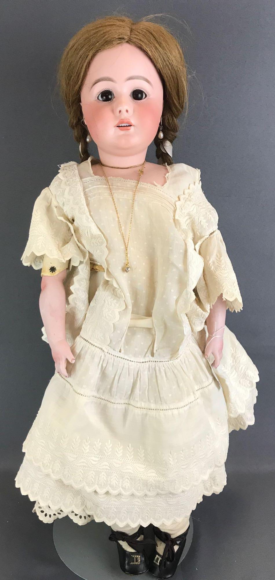 Antique 26 inch German bisque doll SH: Back of head reads S 14 H, 949, possibly Simon & Halbig. Socket head with bisque shoulders, leather body with bisque arms, brown glass sleep eyes with painted lashes, open mouth with teeth, pierced ea